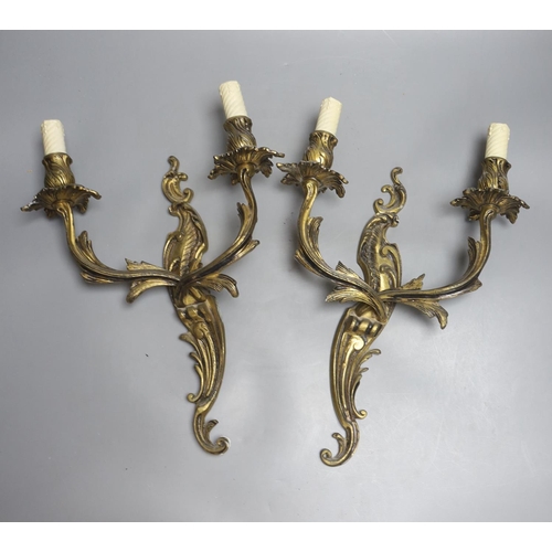 422 - A pair of rococo style twin light wall sconces, and an Italian period style giltwood table lamp, hei... 