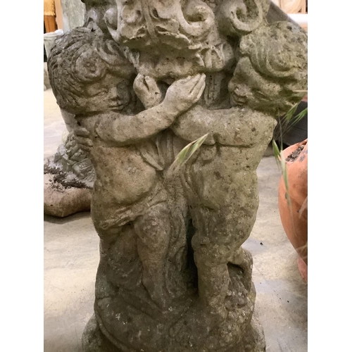 43 - A reconstituted stone figural bird bath, width 30cm, height 54cm