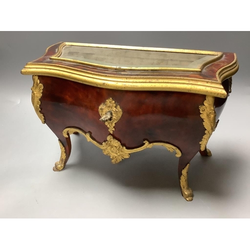 436 - A tortoiseshell and ormolu jewellery casket, modelled in the form of a French commode and a Victoria... 