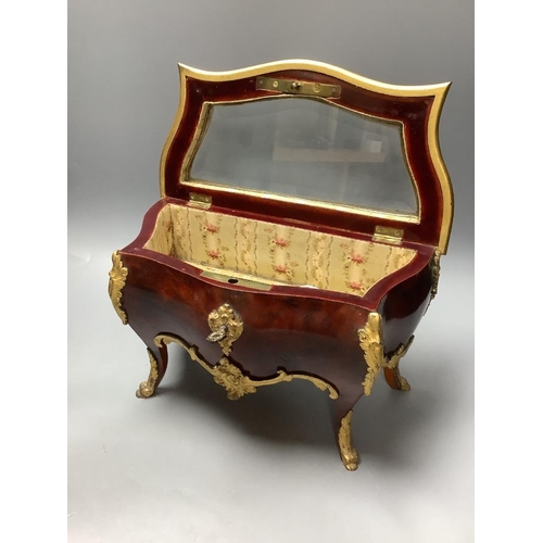 436 - A tortoiseshell and ormolu jewellery casket, modelled in the form of a French commode and a Victoria... 