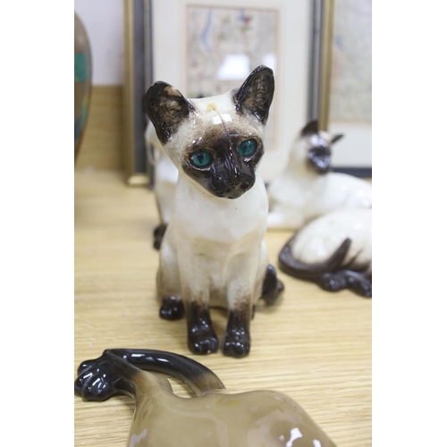 437 - Twelve Beswick cats including Siamese