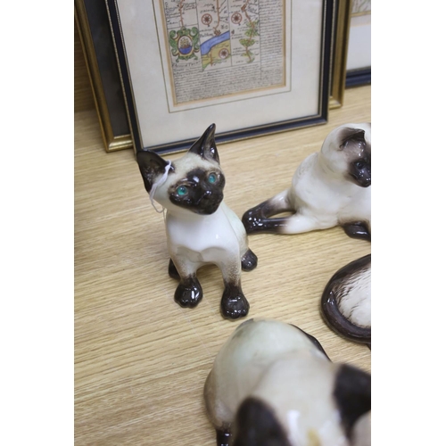 437 - Twelve Beswick cats including Siamese