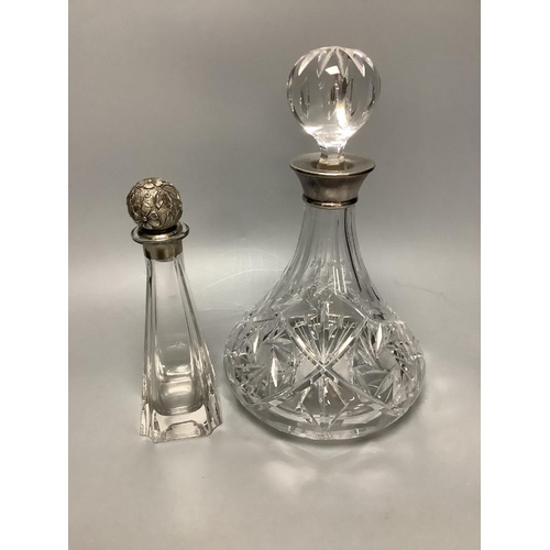 443 - A silver collared cut glass decanter and a glass scent bottle with 800 standard silver stopper, tall... 