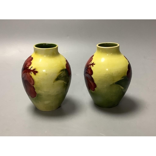 446 - A pair of Moorcroft yelow ground Hibiscus vases, height 9cm