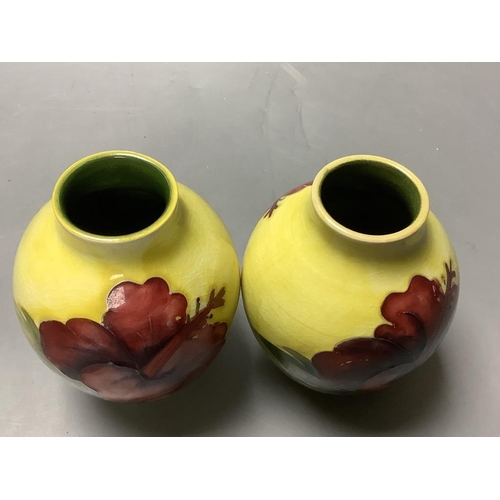 446 - A pair of Moorcroft yelow ground Hibiscus vases, height 9cm