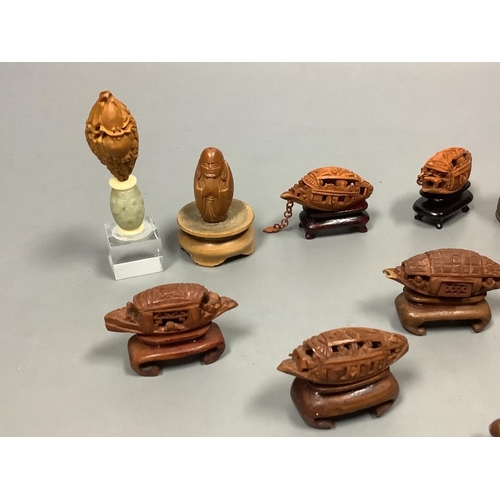 502 - An assortment of Chinese peach stone and nut carvings