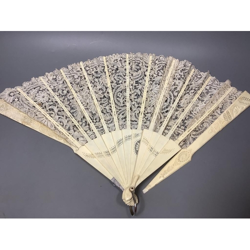 504 - A Brussels lace and ivory fan and four fans