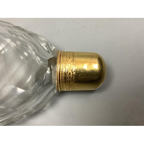 514 - A late 18th/19th century yellow metal topped scent bottle