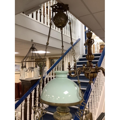 525 - An early 20th century brass hanging oil lamp, drop 85cm