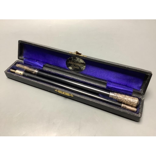 700 - A George V silver mounted ebonised conductors baton in case, 45.3 cm.