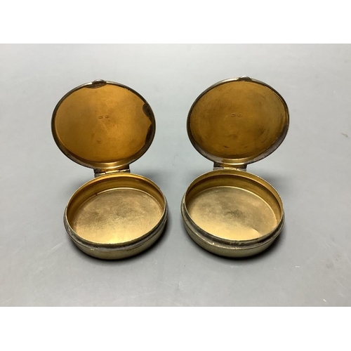 703 - A pair of George V circular silver gilt pill boxes by Asprey Ltd, Birmingham, 1921,  47 mm,  togethe... 