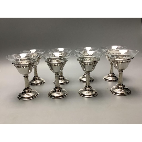 705 - A set of eight Birks sterling mounted glass coupes, height 10.7 cm and a silver mounted two handle g... 