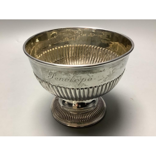 710 - A late Victorian demi fluted silver sugar bowl, Chester 1899, and an Edwardian silver pedestal sauce... 