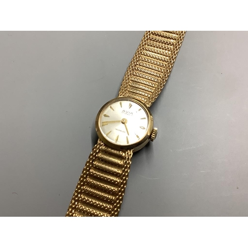 780 - A lady's modern 9ct gold Avia manual wind wrist watch, on integral 9ct gold bracelet, overall 17.5cm... 