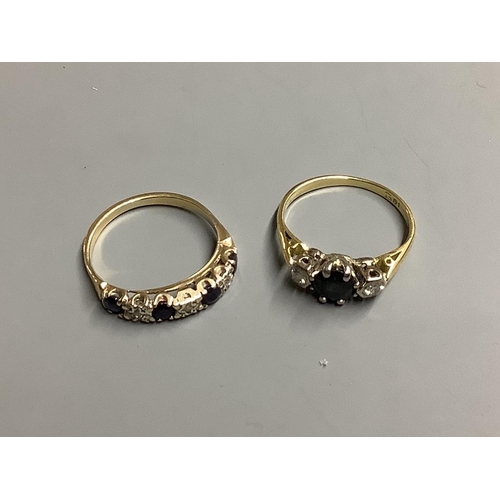 824 - Two yellow metal, sapphire and diamond rings,one stamped 18ct, gross 5.2 grams.