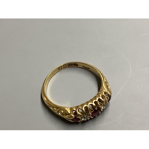 868 - An Edwardian 18ct gold, three stone ruby and two stone diamond set half hoop ring,size M, gross weig... 