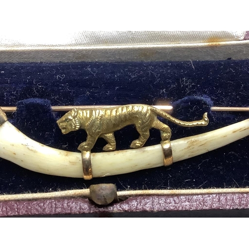 870 - An Indian 14ct and bone mounted 'tiger' set curved brooch, by Hamilton & Co, in original box,7cm, gr... 