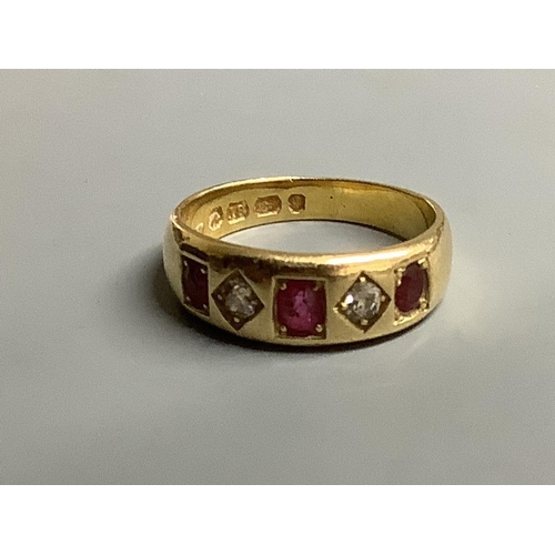 871 - A late Victorian 18ct gold and gypsy set three stone ruby and two stone diamond half hoop ring,size ... 