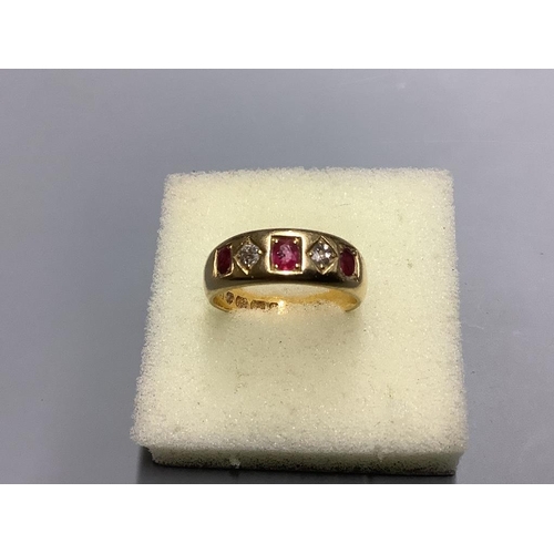 871 - A late Victorian 18ct gold and gypsy set three stone ruby and two stone diamond half hoop ring,size ... 