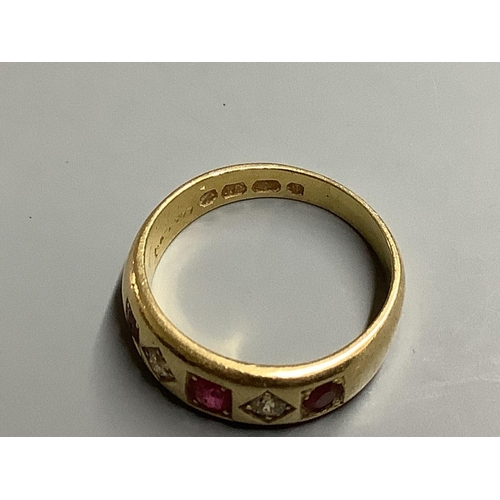 871 - A late Victorian 18ct gold and gypsy set three stone ruby and two stone diamond half hoop ring,size ... 