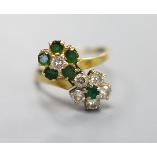 874 - An 18ct, emerald and diamond double flowerhead cluster ring, size M, gross 4.5 grams.