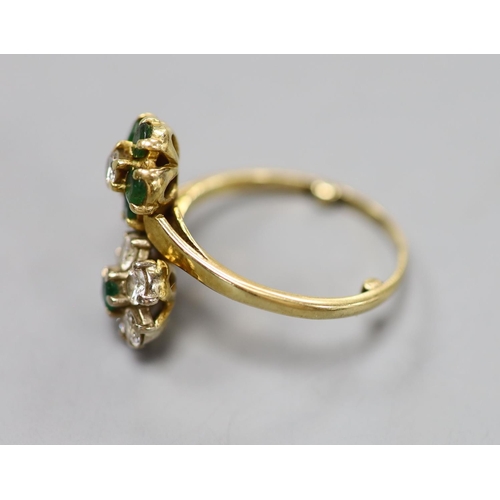 874 - An 18ct, emerald and diamond double flowerhead cluster ring, size M, gross 4.5 grams.