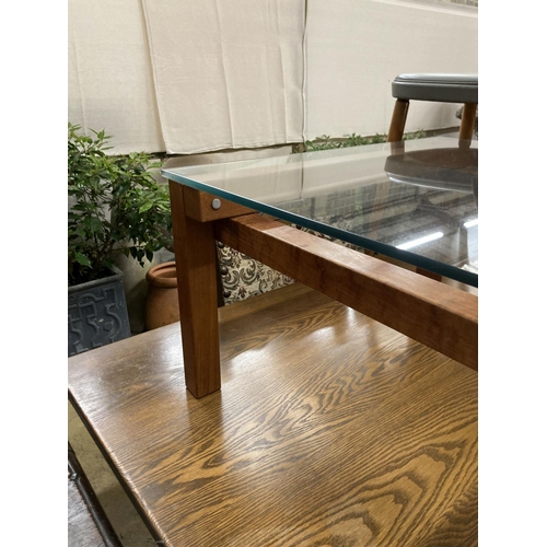 90 - A John Makepeace square glass top coffee table, width 64cm, height 35cm