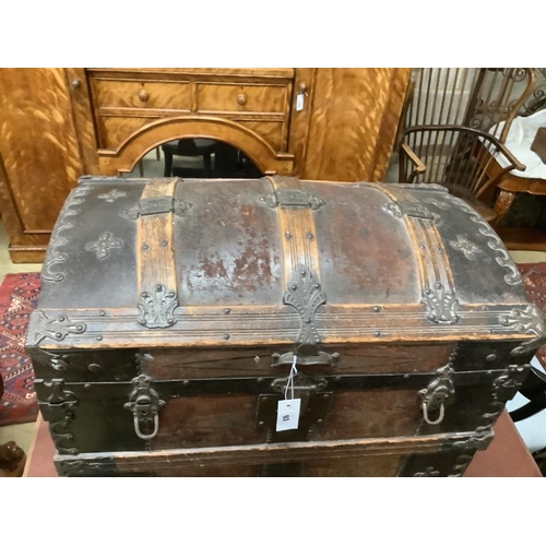 93 - A late Victorian leather and metal mounted dome top trunk with scrap-work interior, length 76cm, dep... 