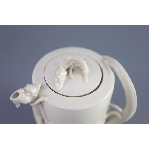 104 - A Chinese soft-paste blanc-de-chine wine ewer, 19th century,the handles, spout and cover finial mode... 