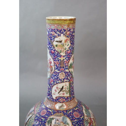 107 - A massive Chinese famille rose blue ground bottle vase, Daoguang period (1821-50),well painted to sh... 