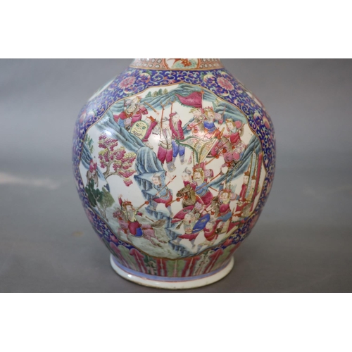 107 - A massive Chinese famille rose blue ground bottle vase, Daoguang period (1821-50),well painted to sh... 