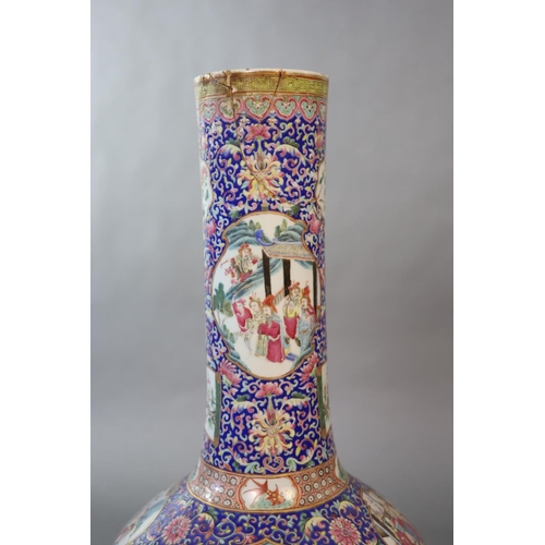 107 - A massive Chinese famille rose blue ground bottle vase, Daoguang period (1821-50),well painted to sh... 