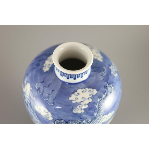 108 - A Chinese blue and white 'dragon' meiping, Kangxi mark but 19th century,painted with dragons chasing... 