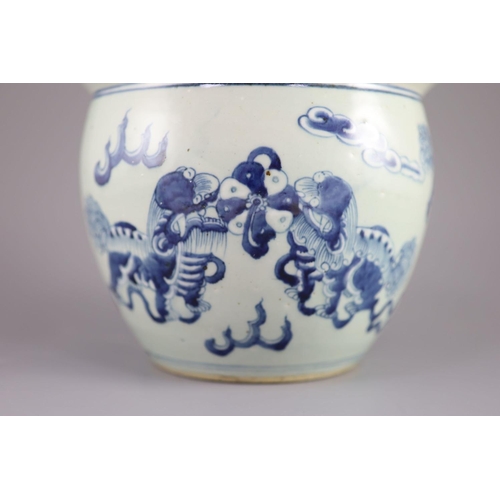 109 - A Chinese blue and white 'lion-dog' flower pot,painted with lion-dogs on white slip, on a pale celad... 