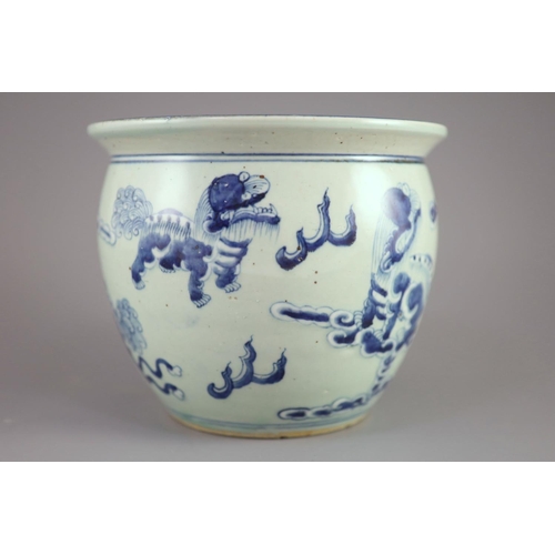 109 - A Chinese blue and white 'lion-dog' flower pot,painted with lion-dogs on white slip, on a pale celad... 