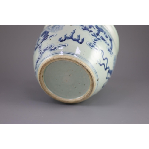 109 - A Chinese blue and white 'lion-dog' flower pot,painted with lion-dogs on white slip, on a pale celad... 