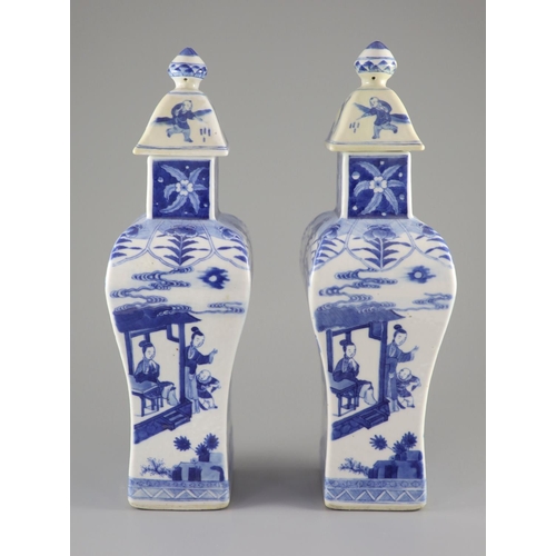 111 - A pair of Chinese blue and white rectangular baluster vases and covers, Kangxi marks but 19th centur... 