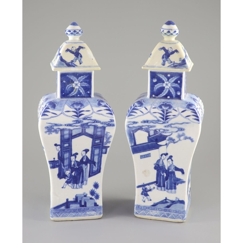 111 - A pair of Chinese blue and white rectangular baluster vases and covers, Kangxi marks but 19th centur... 