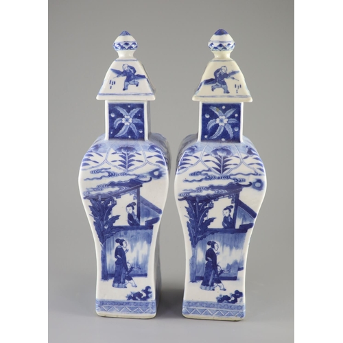 111 - A pair of Chinese blue and white rectangular baluster vases and covers, Kangxi marks but 19th centur... 