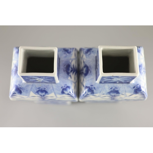 111 - A pair of Chinese blue and white rectangular baluster vases and covers, Kangxi marks but 19th centur... 