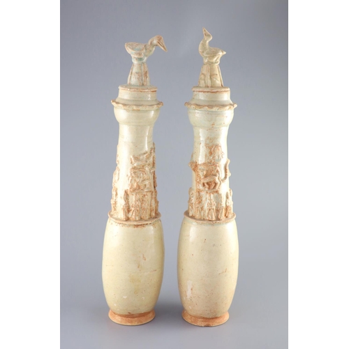 113 - A pair of Chinese pale green glazed funerary vases and covers, Southern Song-Yuan dynasty, probably ... 