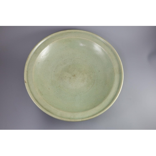 114 - A Chinese Ming Longquan celadon dish, 15th/16th century,crackle to the glaze all over,43cm diameter... 