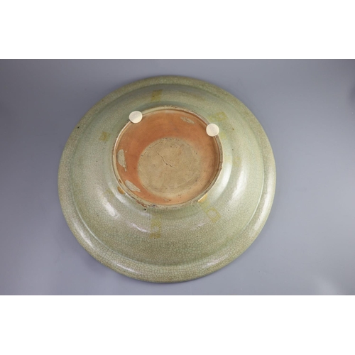 114 - A Chinese Ming Longquan celadon dish, 15th/16th century,crackle to the glaze all over,43cm diameter... 