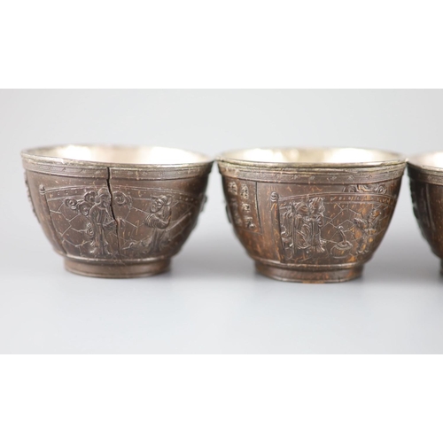 119 - A set of six Chinese coconut cups, 18th/19th century,each carved in relief with figures amid pavilio... 