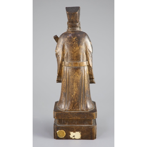 123 - A Chinese boxwood figure of an immortal, 19th century,the figure holding a tablet in his left hand a... 