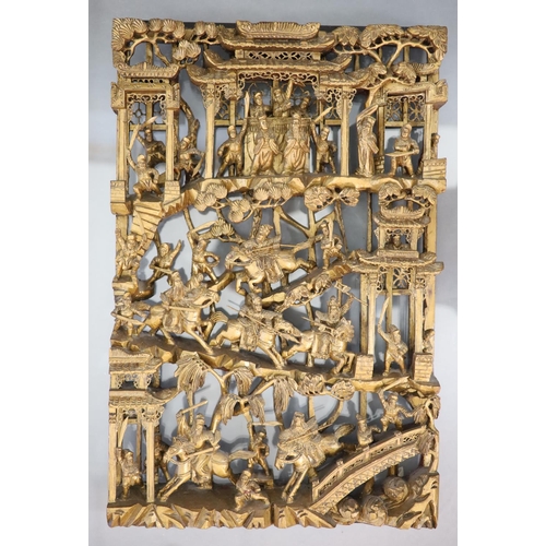 124 - A pair of Chinese giltwood panels, late 19th centuryeach carved with battle scenes with dignitaries ... 