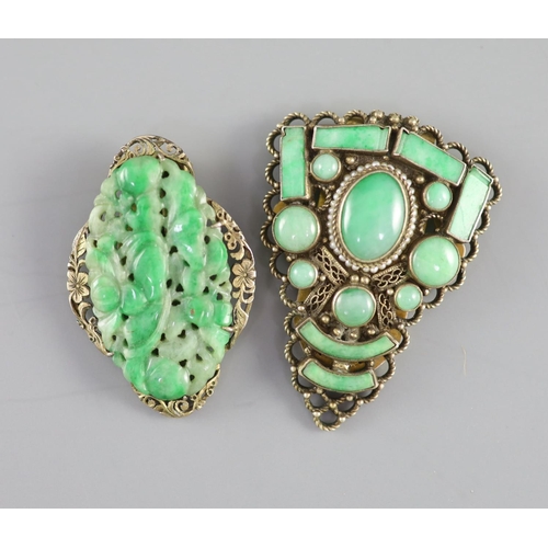 139 - Two Chinese jadeite and gilt metal clips, first half 20th century and a yellow metal jadeite fish ... 