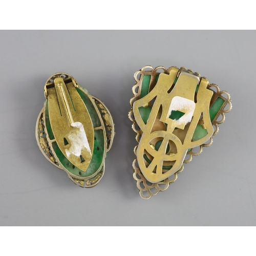 139 - Two Chinese jadeite and gilt metal clips, first half 20th century and a yellow metal jadeite fish ... 