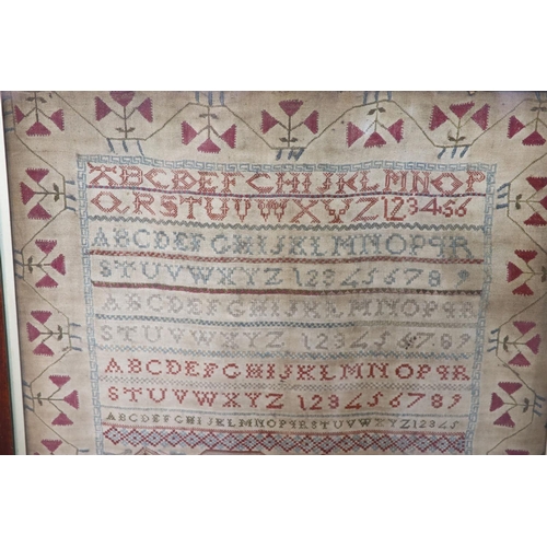 14 - A large William IV alphabetical sampler, by Mary Ann Cox, dated 1831,decorated with a scene of The ... 