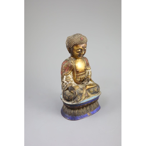 158 - A Chinese copper alloy and enamel seated figure of Buddha Shakyamuni, Qing dynasty,on a double lotus... 